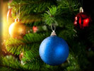 Blue Christmas Bauble on a Pine Tree